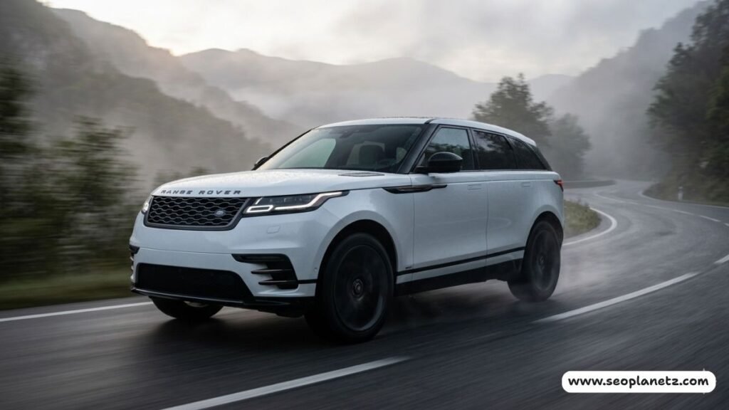 2026 Range Rover Velar white driving mountain road action shot