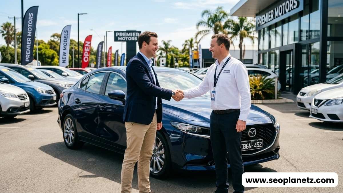 How to negotiate price for used car buyer shaking hands with dealer at dealership in 2026