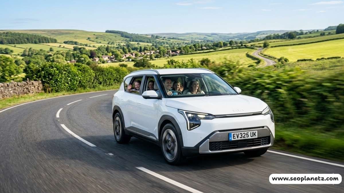 white Kia EV3 electric family SUV on a UK country road surrounded by green hills