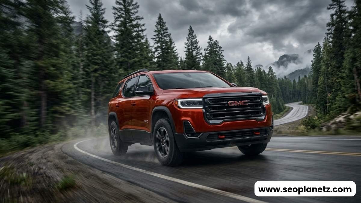 2025 GMC Acadia AT4 Volcanic Red driving mountain highway